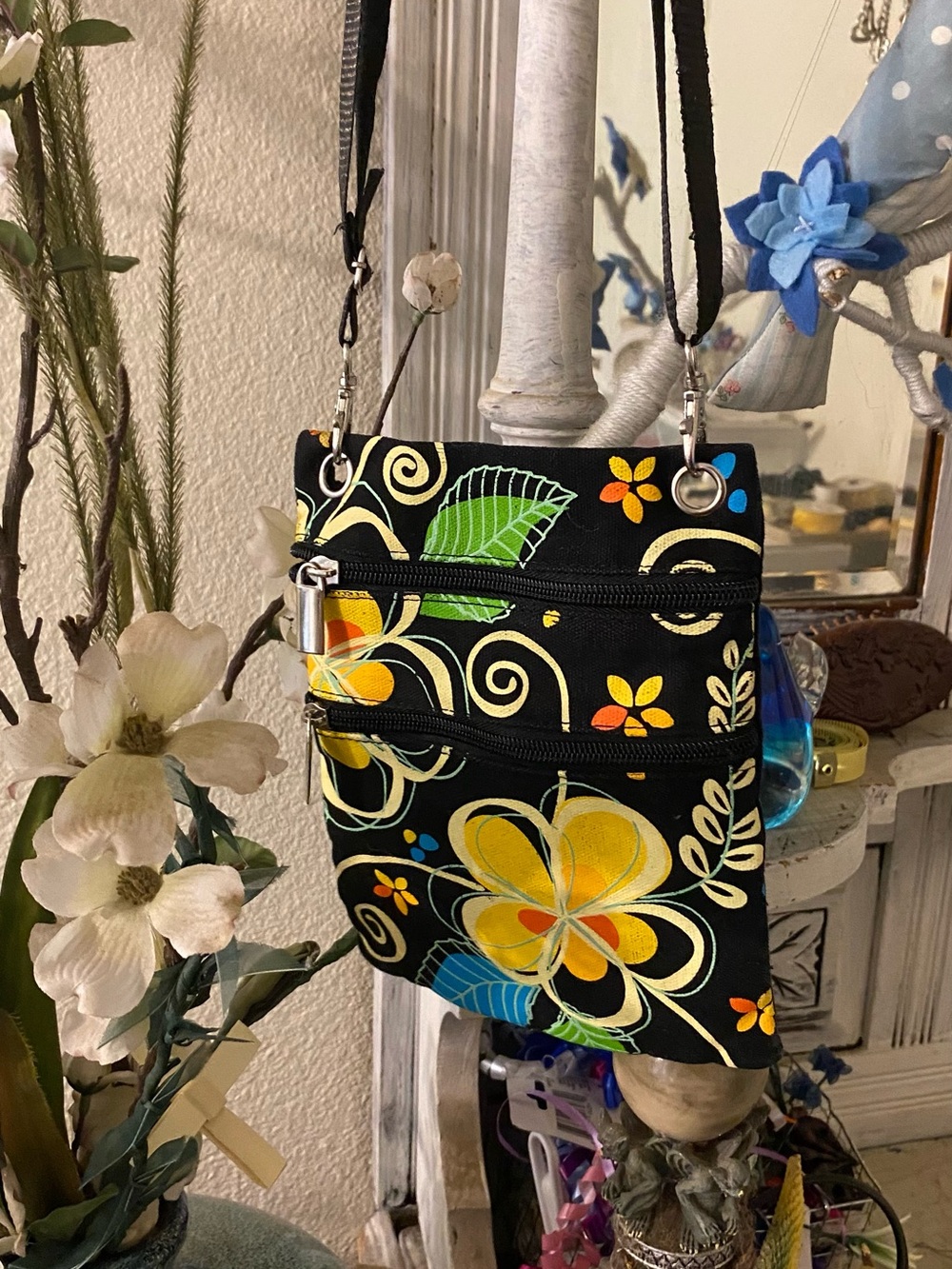 Black Floral Crossbody Bag with Yellow and Blue Accents